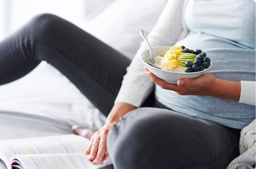 Pregnant woman focusing on nutritional health